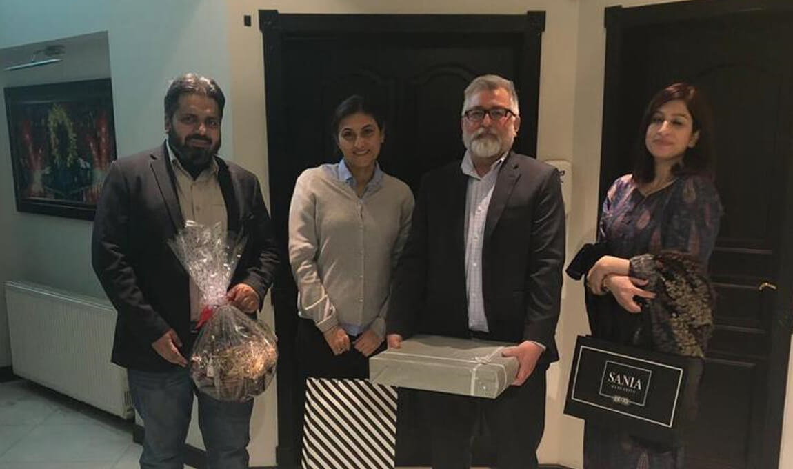 Mrs. Ayesha Shaikh presenting souvenirs to Mr.Douglas V. Janoff Head of Regional & Public Affairs at Canadian High Commission – Islamabad