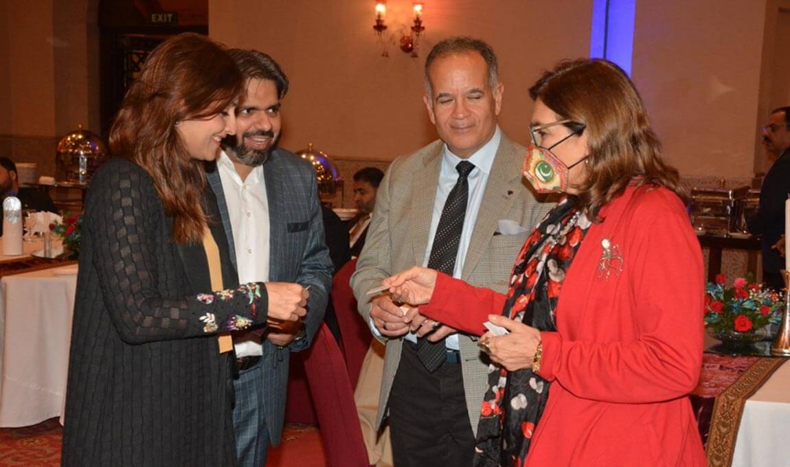 Mrs. Ayesha Shaikh with the EU Ambassador to Pakistan red jacket main,  H.E. Androulla Kaminara