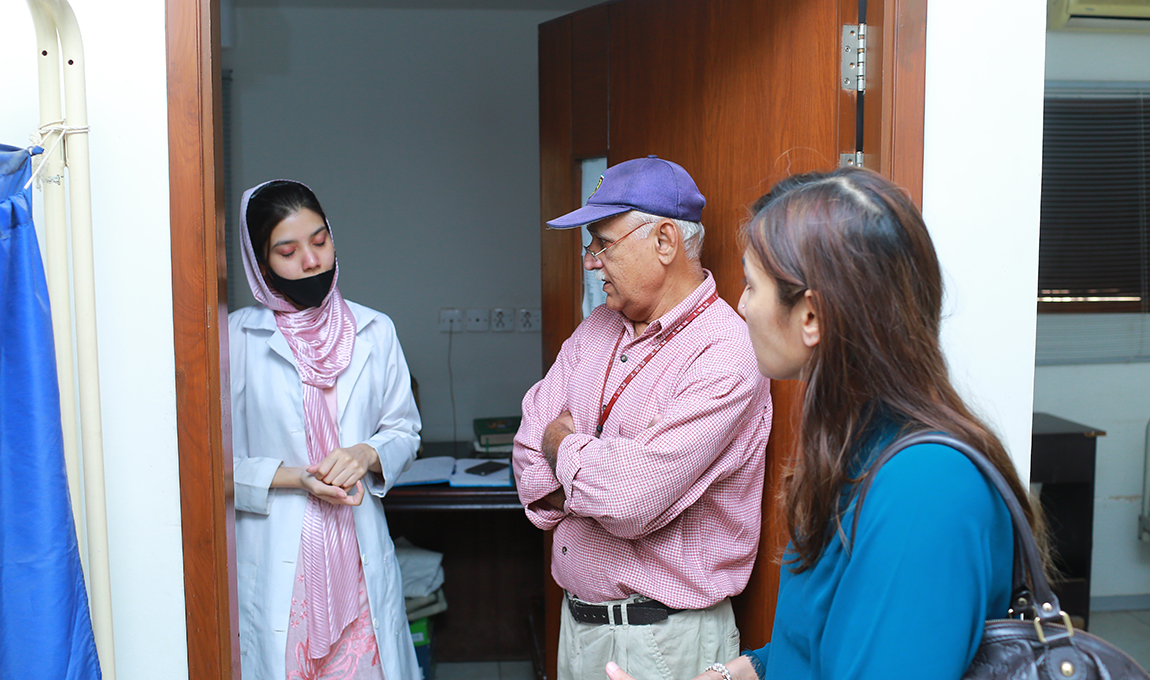 Mrs. Ayesha Shaikh is having a converstation with the staff working at the Rabia Moon Trust along with a senior representative of the trust